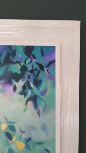 A Tangled Affair original painting of twisted willow tree and its tangled vine like leaves, in shades of purple, lilac, soft cool green and pops of yellow, in a bespoke off white frame.