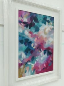 A Softly blended pink and blue abstracted leafy tree canopy painting, in a bespoke white frame, from the Canopy Series by Irish nature artist Eibhilin Crossan