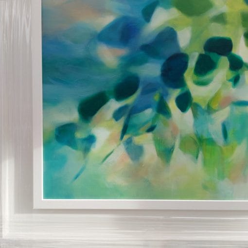 A close up of an original painting on canvas of tree leaves in spring like shades of blue and green, with a hint of yellow, in a bespoke off white frame.