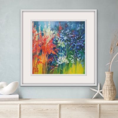 Colourful floral original painting in a white frame of agapanthus flowers growing wild by Irish nature artist Eibhilin Crossan
