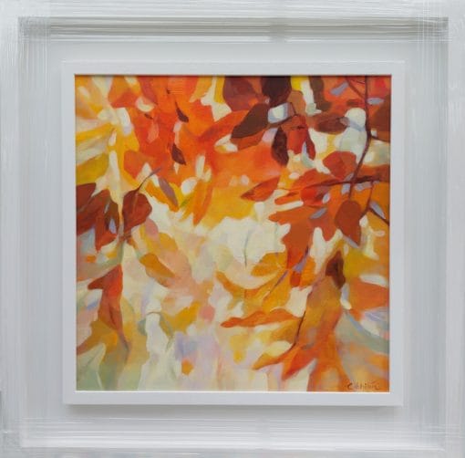 An original painting on canvas of a leafy canopy scene in mellow autumnal orange, gold and brown shades, in a bespoke off white frame.
